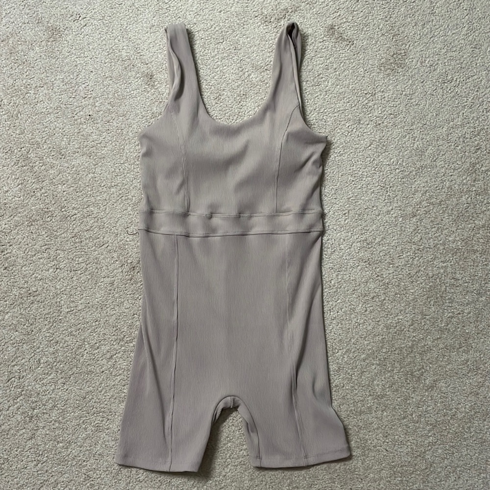 Ribbed one piece shorts bodysuit.  Mauvey beige color. Size XL